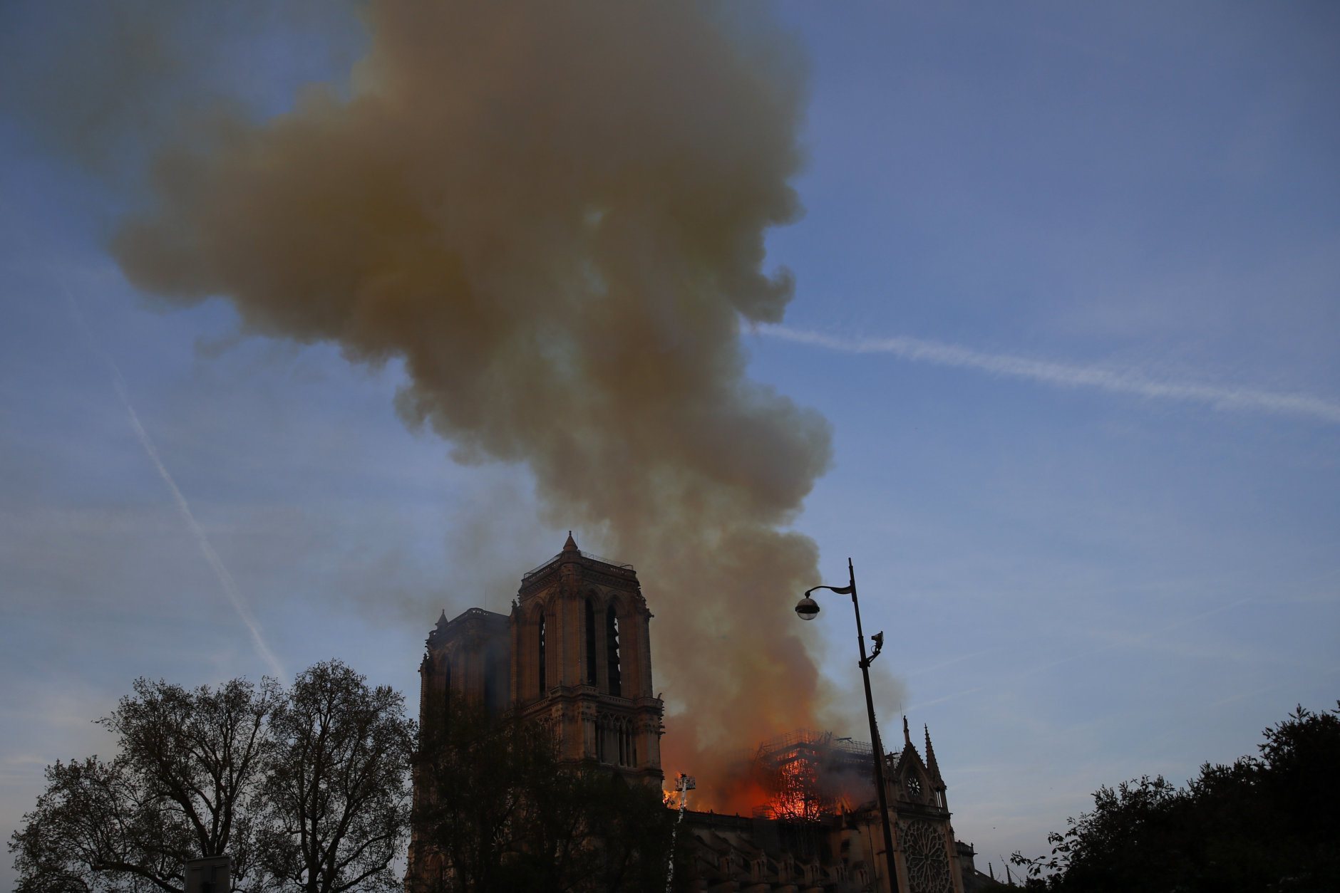 Notre Dame cathedral is burning in Paris, Monday, April 15, 2019. A catastrophic fire engulfed the upper reaches of Paris' soaring Notre Dame Cathedral as it was undergoing renovations Monday, threatening one of the greatest architectural treasures of the Western world as tourists and Parisians looked on aghast from the streets below. (AP Photo/Francois Mori)