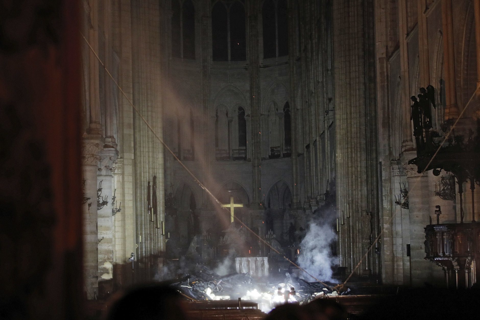 Smoke is seen in the interior of Notre Dame cathedral in Paris, Monday, April 15, 2019. A catastrophic fire engulfed the upper reaches of Paris' soaring Notre Dame Cathedral as it was undergoing renovations Monday, threatening one of the greatest architectural treasures of the Western world as tourists and Parisians looked on aghast from the streets below. (Philippe Wojazer/Pool via AP)