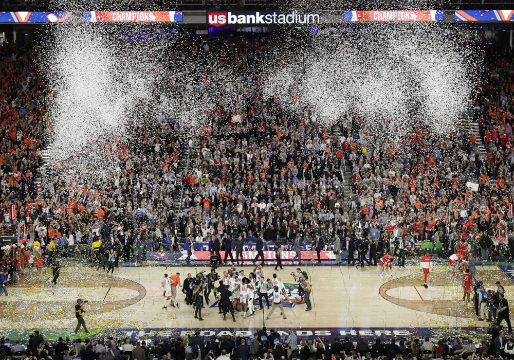 Virginia players celebrate after defeating Texas Tech 85-77 in the overtime in in the championship of the Final Four NCAA college basketball tournament, Monday, April 8, 2019, in Minneapolis. (AP Photo/Matt York)