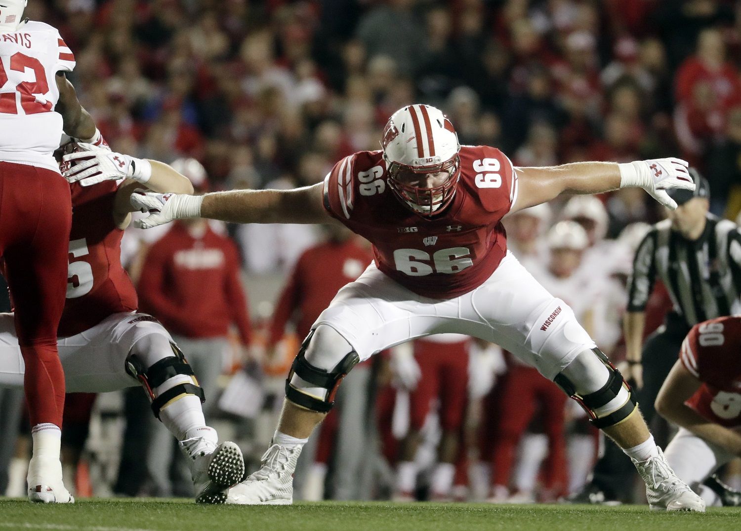 In this Oct. 6, 2018, file photo, Wisconsin's Beau Benzschawel blocks during the first half of a game against Nebraska in Madison, Wis. Benzschawel was named to the 2018 AP All-America NCAA college football team, Monday, Dec. 10, 2018. (AP Photo/Morry Gash, File)