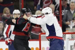 Washington Capitals' Alex Ovechkin, right, of Russia, punches Carolina Hurricanes' Andrei Svechnikov, also of Russia, during the first period of Game 3 of an NHL hockey first-round playoff series in Raleigh, N.C., Monday, April 15, 2019. (AP Photo/Gerry Broome)