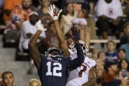 Auburn defensive back Jamel Dean (12) gets into position to defend a pass to Arkansas wide receiver Jonathan Nance (7) during the first half of an NCAA college football game, Saturday, Sept. 22, 2018, in Auburn, Ala. (AP Photo/Vasha Hunt)