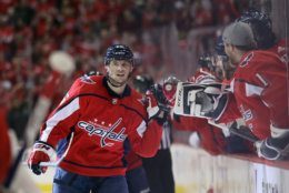 WASHINGTON, DC - APRIL 24: Andre Burakovsky #65 of the Washington Capitals celebrates his goal at 2:13 of the first period against the Carolina Hurricanes in Game Seven of the Eastern Conference First Round during the 2019 NHL Stanley Cup Playoffs at the Capital One Arena on April 24, 2019 in Washington, DC. (Photo by Patrick Smith/Getty Images)