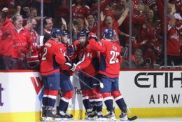 WASHINGTON, DC - APRIL 24: The Washington Capitals celebrate a goal by Andre Burakovsky #65 against the Carolina Hurricanes at 2:13 of the first period in Game Seven of the Eastern Conference First Round during the 2019 NHL Stanley Cup Playoffs at the Capital One Arena on April 24, 2019 in Washington, DC. (Photo by Patrick Smith/Getty Images)