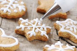 Christmas cinnamon cookies icing decorating process with a pastry bag