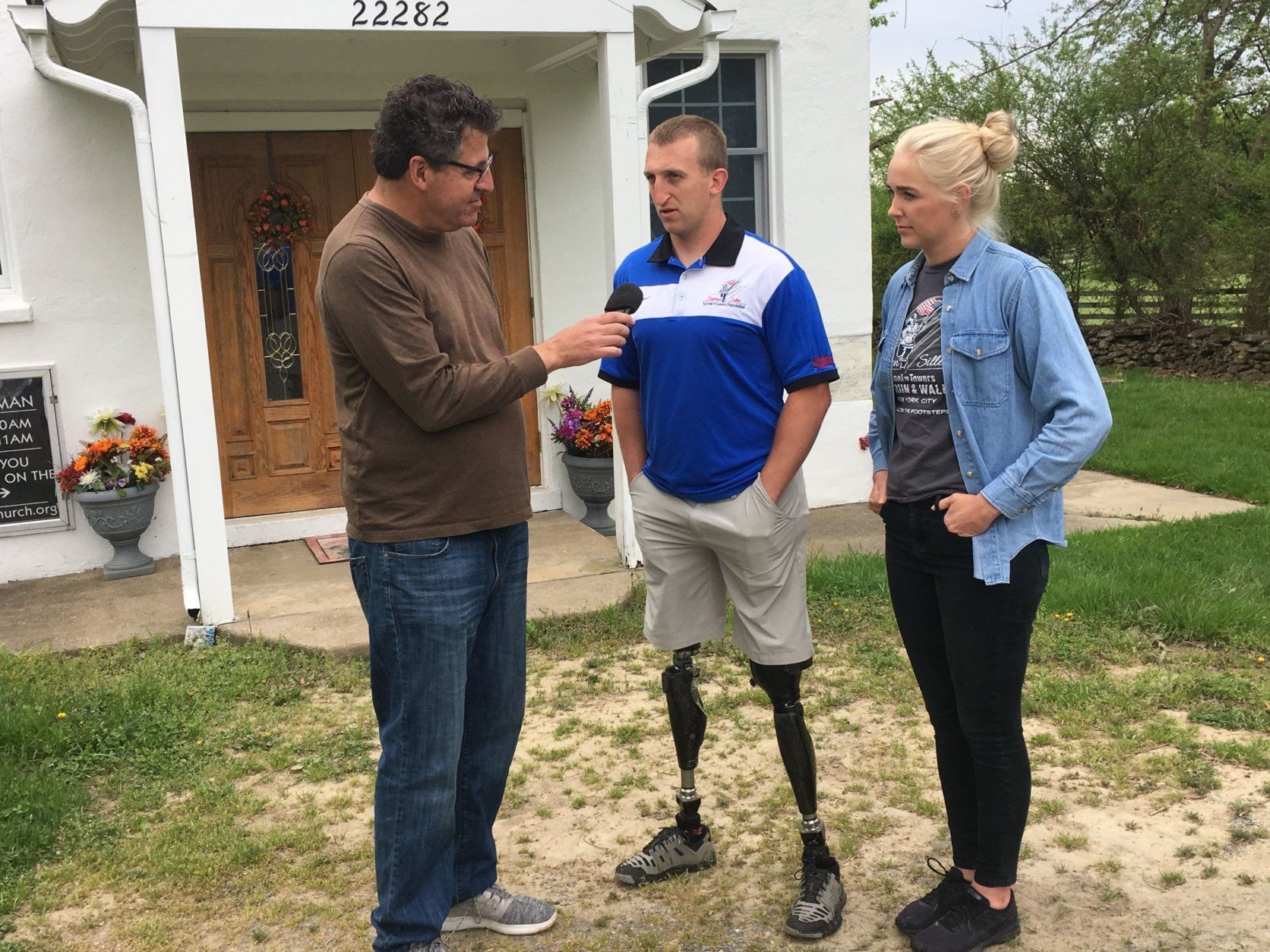 Marine Sgt. Rob Jones and his wife Pamela speak with WTOP's Neal Augenstein before seeing their new home. (Courtesy Amelia Augenstein)