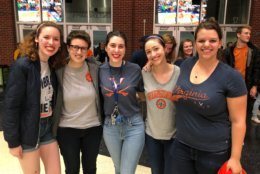 U.Va graduate students studying to be Spanish teachers. One described anxiously sitting on the edge of her seat during the game. Another said she was pumping her fist so strongly in the air, she became concerned she’d throw her phone. (WTOP/Kristi King)