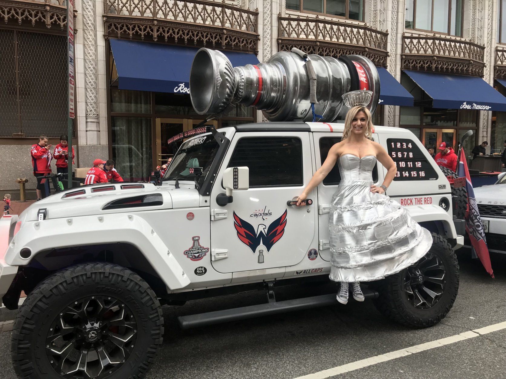 A fan who became a social media sensation when she attended a Caps game dressed as the Stanley Cup donned her now-locally famous costume to pose with the Holtbeast (Courtesy Ed Twomey)