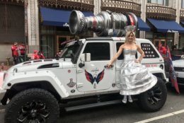 A fan who became a social media sensation when she attended a Caps game dressed as the Stanley Cup donned her now-locally famous costume to pose with the Holtbeast (Courtesy Ed Twomey)