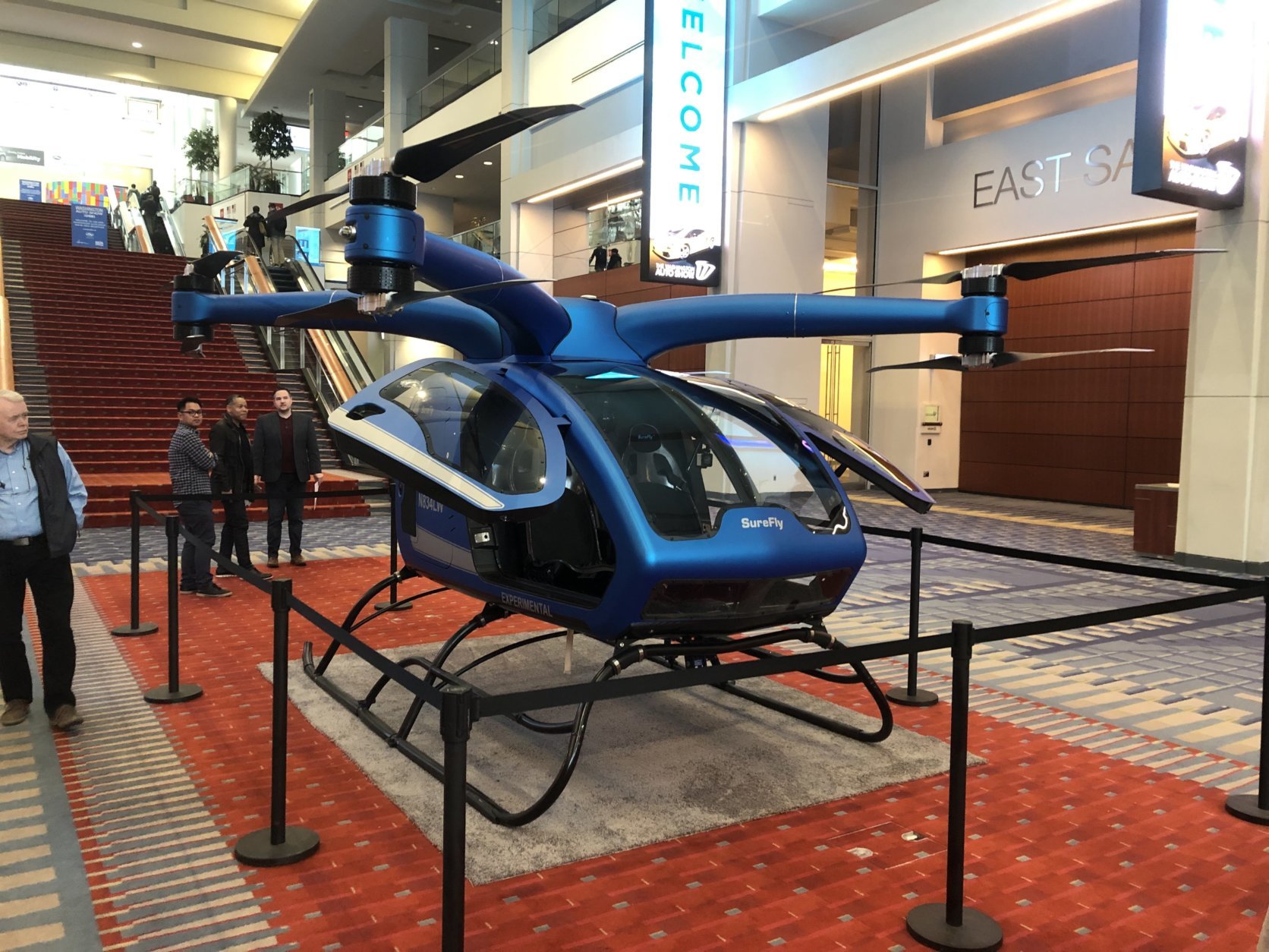 Surefly’s newest electric helicopter looks like an over-sized drone and is being dubbed the “flying car” of tomorrow.(WTOP/Mike Murillo)