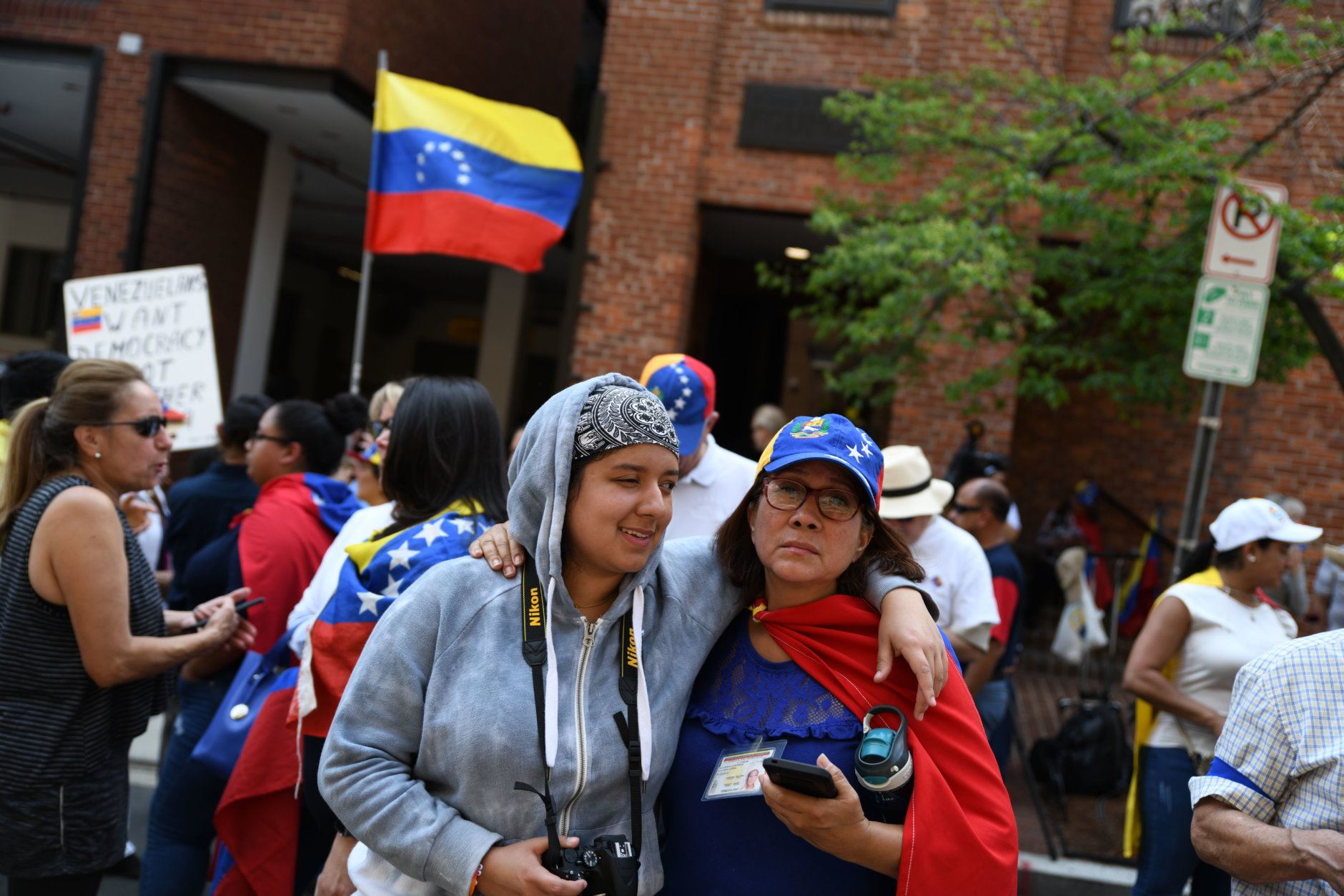 Opposing protests crowd streets outside Venezuelan Embassy in ...
