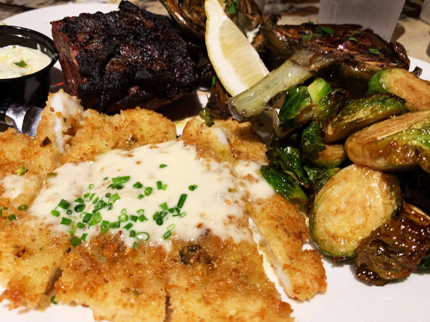 Pismo's is known for its seafood, especially the calamari steak. (WTOP/Noah Frank)