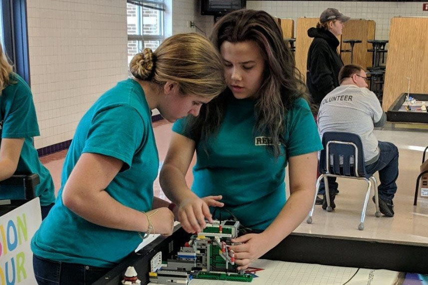 Emma Hrabak and Reira Erickson test their robot and program during a practice run at the Regionals Competition, held at Hayfield Secondary School in Alexandria, Virginia, on Nov. 18, 2018. (Courtesy Merrie Joy Hrabak)