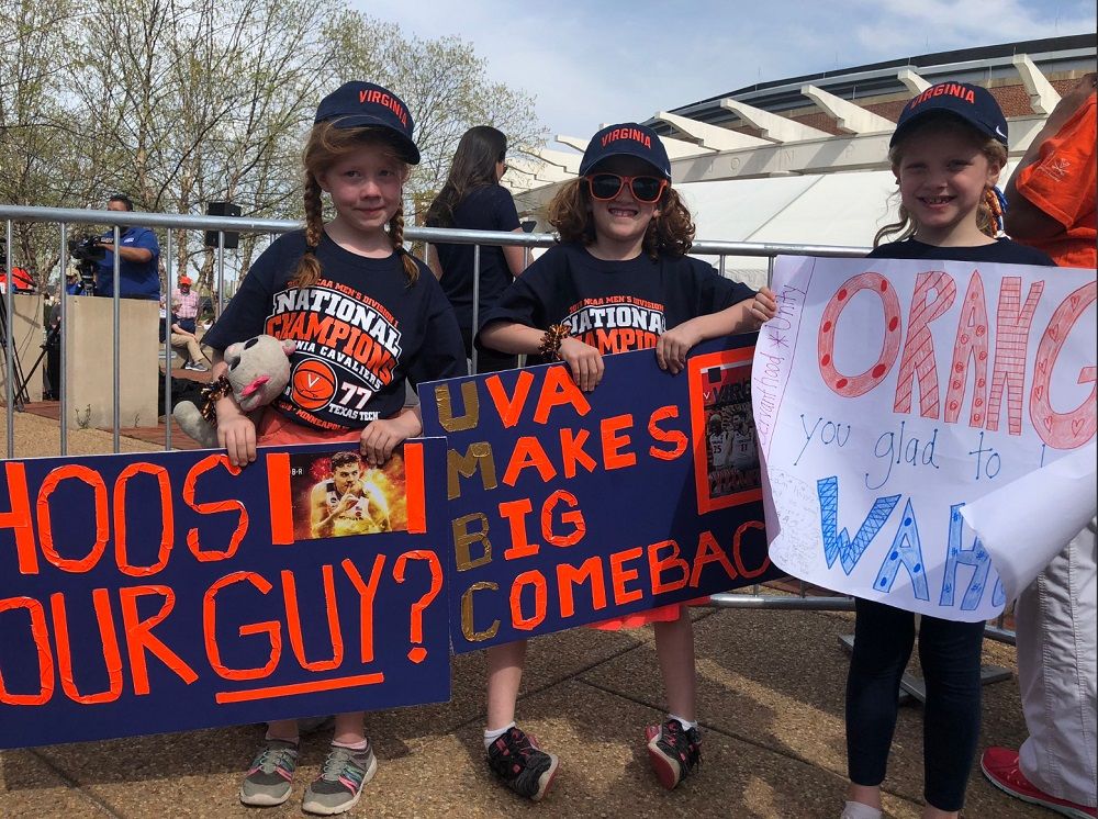 Waiting to welcome home the Cavaliers at John Paul Jones Arena: These 7-year-old cousins from Lynchburg, Virginia. Twins Charlotte and Eva Kendall, and Lawson Bendall waited on the team's arrival Tuesday, April 9, 2019. (WTOP/Kristi King)