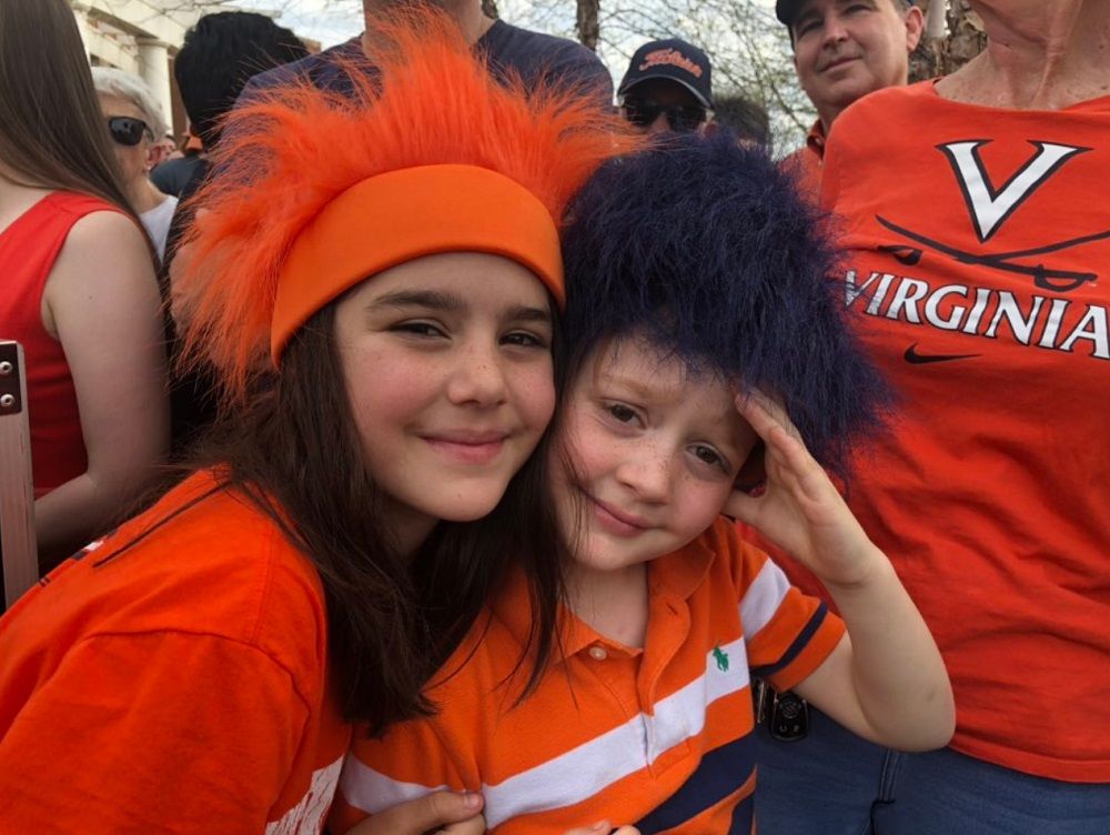 Rosie and Charlie Spencer of Rutherford Glen, Virginia, waited excitedly to welcome the team on Tuesday, April 9, 2019. (WTOP/Kristi King)