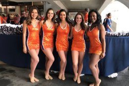 Members of the University of Virginia's dance team participate in the celebration for the school's winning basketball team. (WTOP/Michelle Basch)