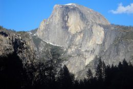 This April 2013 image shows Half Dome, the iconic granite peak in Yosemite National Park in California. Beautiful scenery, from mountain views to waterfalls, is easily accessible to visitors at Yosemite. (AP Photo/Kathy Matheson)