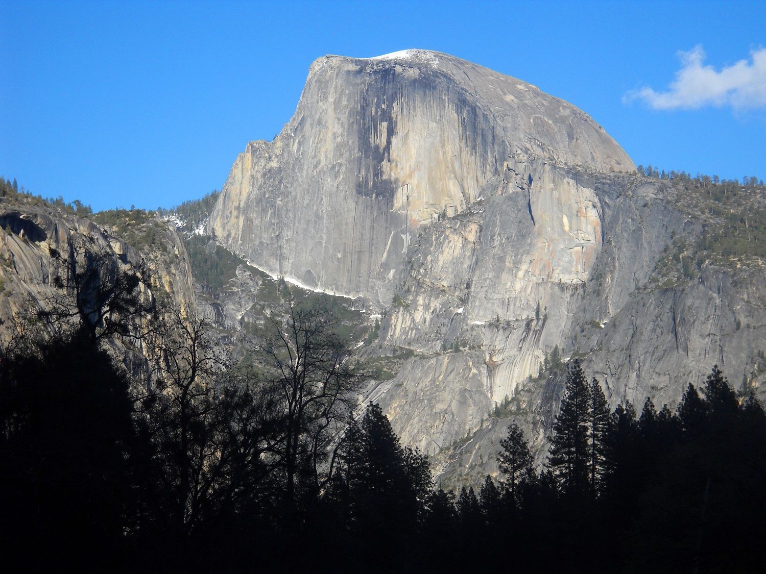 This April 2013 image shows Half Dome, the iconic granite peak in Yosemite National Park in California. Beautiful scenery, from mountain views to waterfalls, is easily accessible to visitors at Yosemite. (AP Photo/Kathy Matheson)