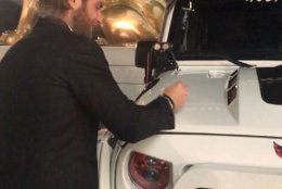 Braden Holtby signs the Caps Jeep. (Courtesy Ed Twomey) 