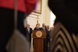 Sen. Barbara Mikulski speaks at the ceremony where the late House Speaker Michael Busch lies in state. She is flanked by Gov. Larry Hogan and Lt. Gov. Boyd Rutherford. (WTOP/Kate Ryan)