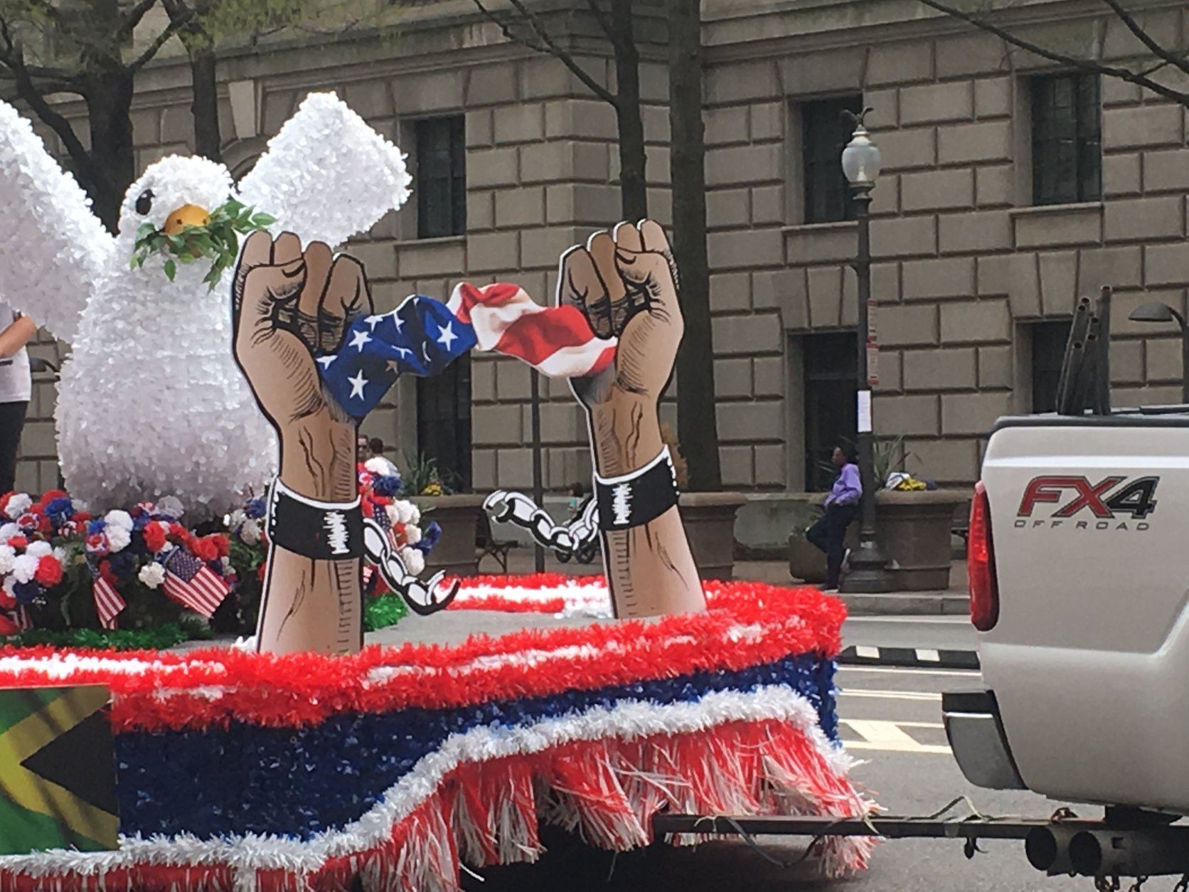A float glides along during the Emancipation Day Parade in D.C. on Saturday, April 13, 2019. (WTOP/Rick Massimo)