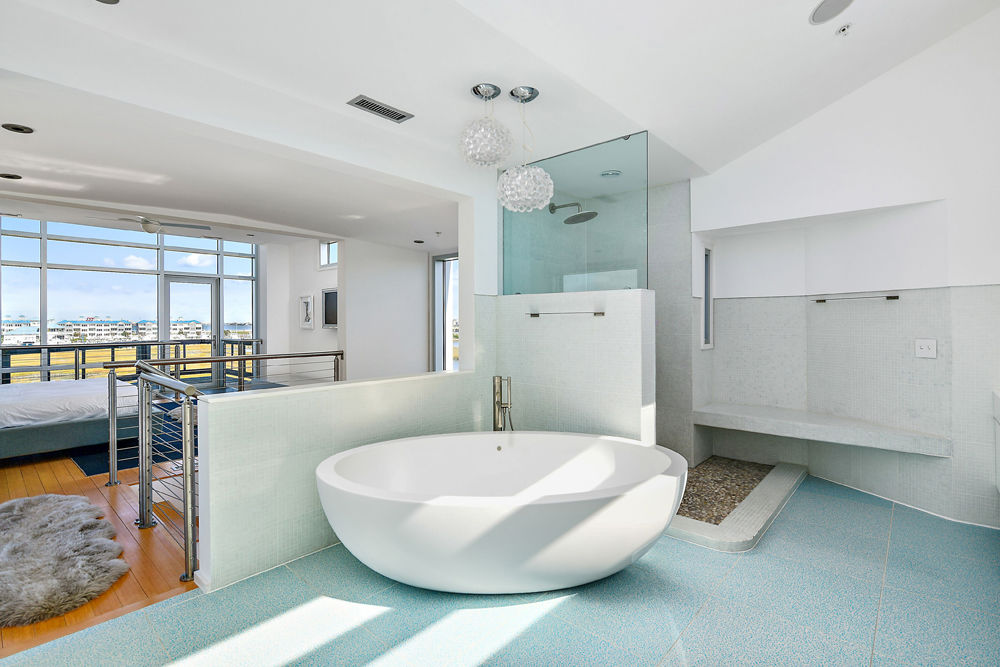 The bathroom of one of the master suites has a 600 pound tub and a rain shower. (Courtesy Svetlana Leahy)
