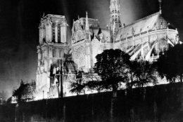 This is a nighttime view of the Cathedral of Notre Dame, Our Lady, on the island called Ile de la Cite in Paris, France, in 1933.  (AP Photo)