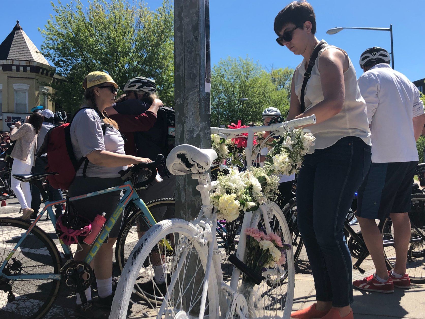 Mourners leave a ghost bike in memory of David Salovesh, who died on Florida Avenue in Northeast D.C. (WTOP/Melissa Howell)
