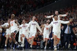 Virginia players celebrate after defeating Texas Tech 85-77 in the championship game of the Final Four NCAA college basketball tournament, Monday, April 8, 2019, in Minneapolis. (AP Photo/David J. Phillip)