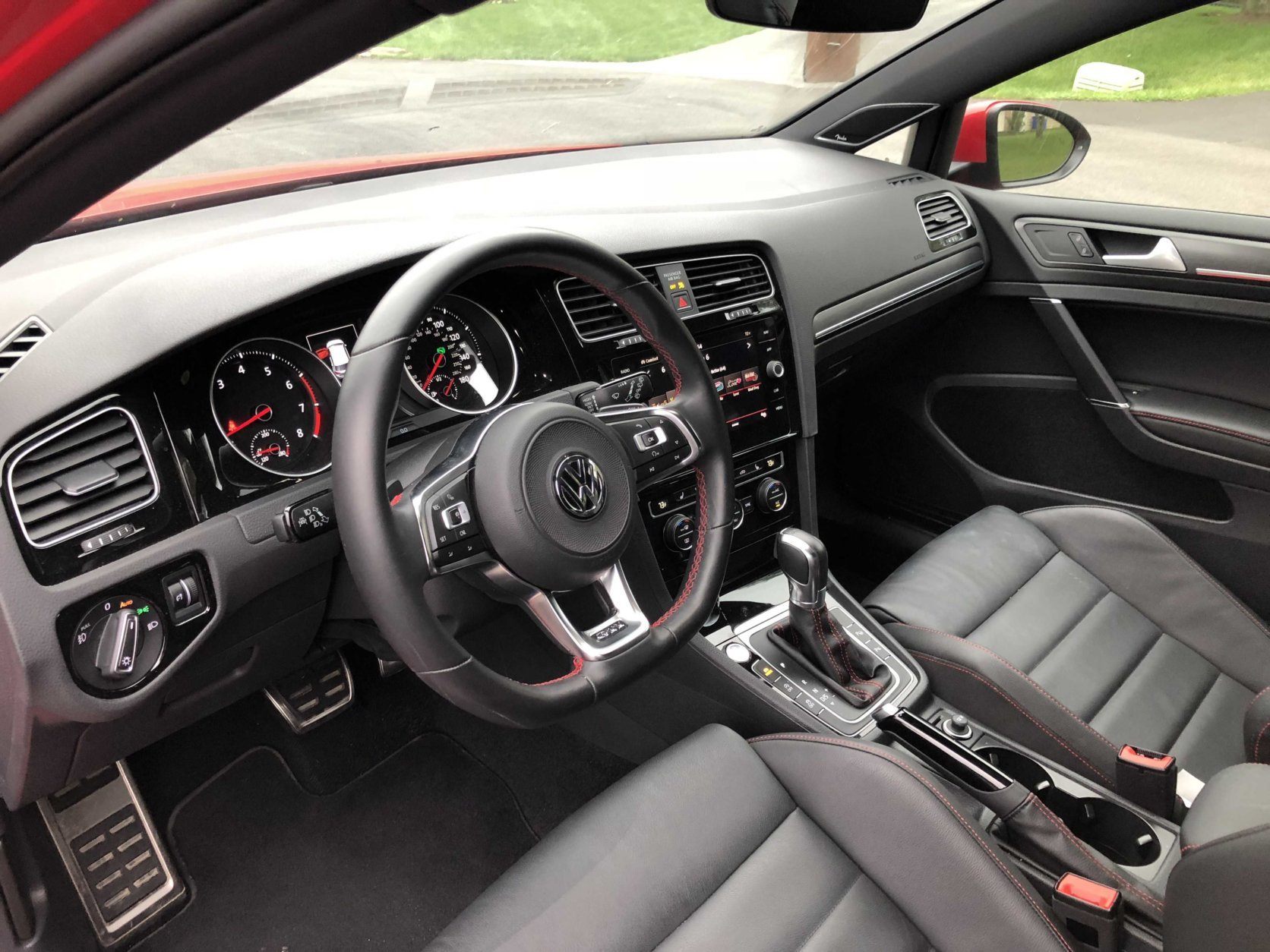 Red stitching on the steering wheel and seats add to the luxurious look of the GTI. (WTOP/Mike Parris)