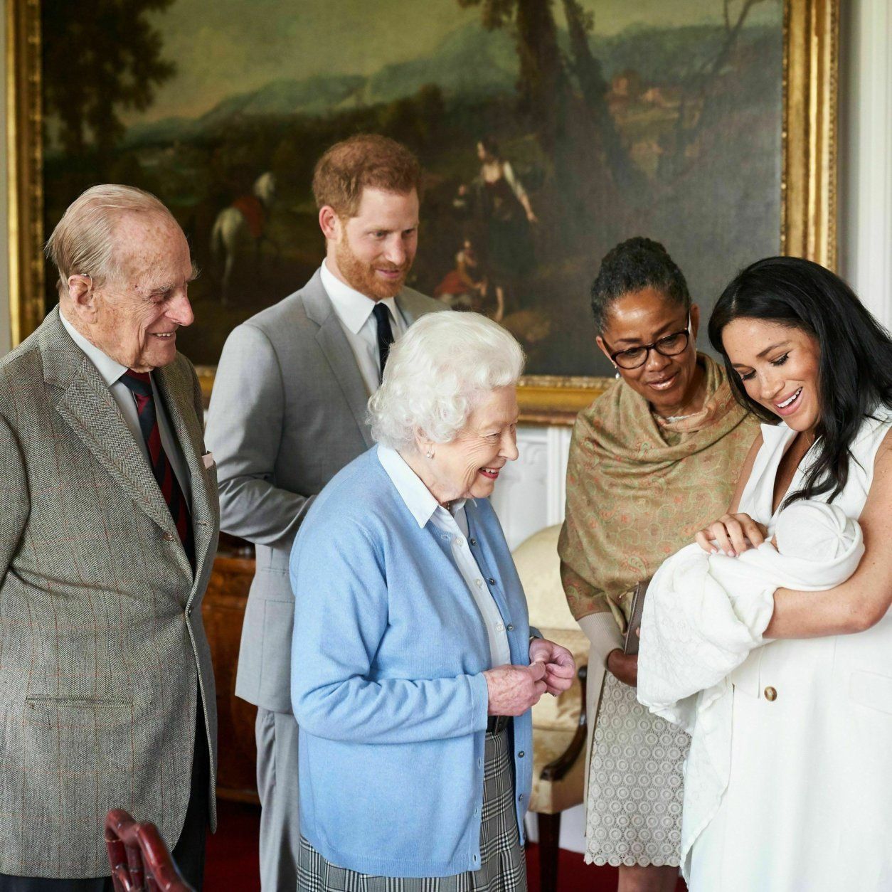 In this image made available by SussexRoyal on Wednesday May 8, 2019, Britain's Prince Harry and Meghan, Duchess of Sussex, joined by her mother Doria Ragland, show their new son to Queen Elizabeth II and Prince Philip at Windsor Castle, Windsor, England. Prince Harry and Meghan have named their son Archie Harrison Mountbatten-Windsor. (Chris Allerton/SussexRoyal via AP)