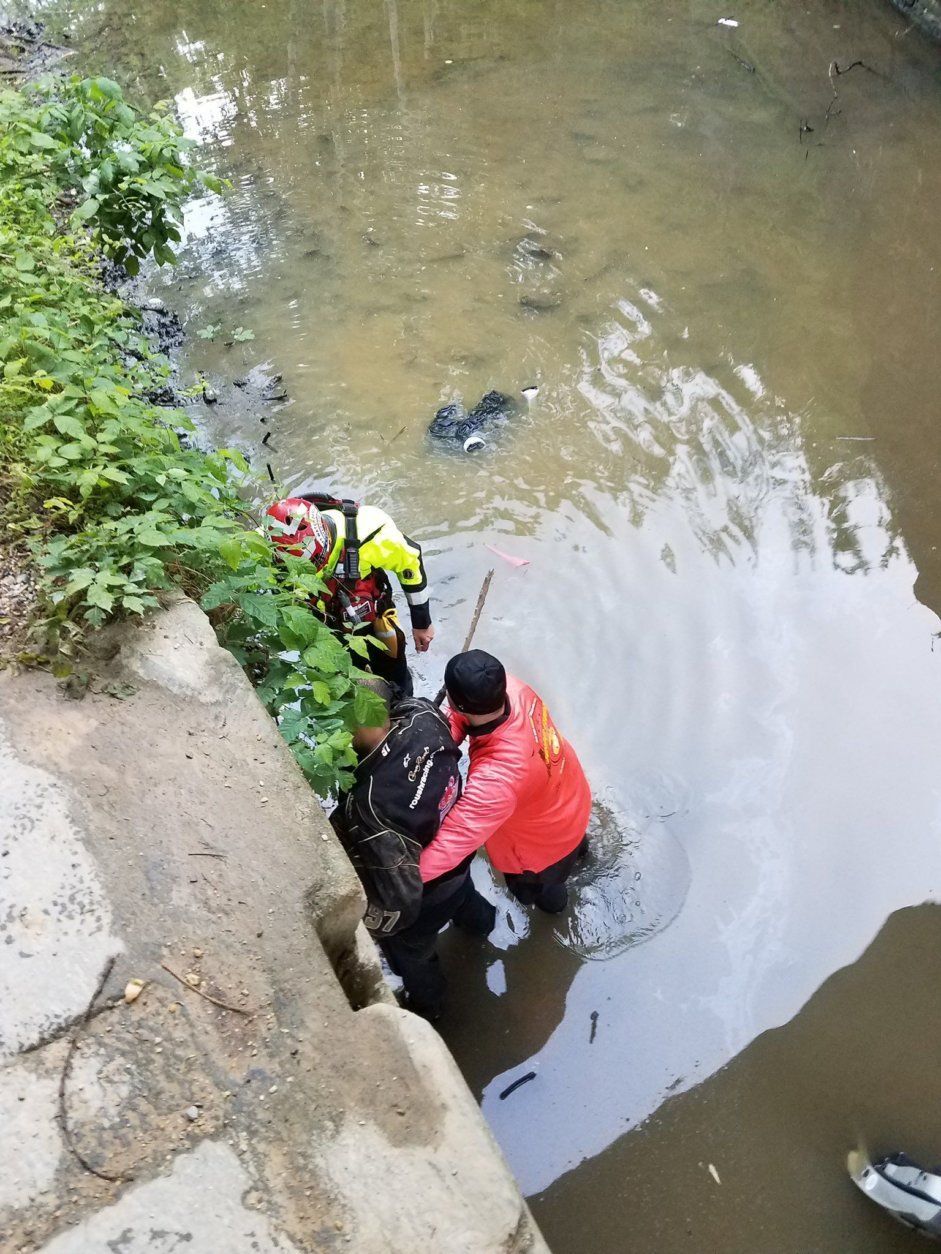 Two people were hospitalized after a car overturned in the C&O Canal on Wednesday morning. (Courtesy Montgomery County Fire & EMS)