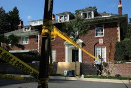 WASHINGTON, DC - MAY 19:  District of Columbia Metropolitan Police maintain a perimeter around the house on the 3200 block of Woodland Drive NW May 19, 2015 in Washington, DC. Firefighters discovered the bodies of Savvas Savopoulos, 46, his wife Amy, 47, their 10-year-old son Philip, and the housekeeper, Veralicia Figueroa, 57, last Thursday afternoon when they responded to a fire at the house. Two Savopoulos daughters were away in boarding school at the time. Investigators have ruled the deaths homicides and say they could continue to collect evidence at the house for another week. (Photo by Chip Somodevilla/Getty Images)