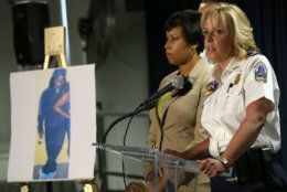 WASHINGTON, DC - MAY 21: Mayor Muriel Bowser (L) of Washington, DC listens as Chief of the Metropolitan Police Department Cathy Lanier (R) speaks at a press conference at police headquarters May 21, 2015 in Washington, DC. Bowser and Lanier asked the public for help in locating a suspect, Daron Dylon Wint, in a quadruple murder in the killing of Savvas Savopoulos and his family. Authorities believe Wint may have traveled to the Brooklyn, New York area. (Photo by Win McNamee/Getty Images)