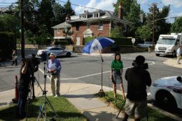 WASHINGTON, DC - MAY 19:  Television reporters and photographers set up across the street from a house on the 3200 block of Woodland Drive NW May 19, 2015 in Washington, DC. Firefighters discovered the bodies of Savvas Savopoulos, 46, his wife Amy, 47, their 10-year-old son Philip, and the housekeeper, Veralicia Figueroa, 57, last Thursday afternoon when they responded to a blaze at the house. Two Savopoulos daughters were away in boarding school at the time. Investigators have ruled the deaths homicides and say they could continue to collect evidence at the house for another week.  (Photo by Chip Somodevilla/Getty Images)
