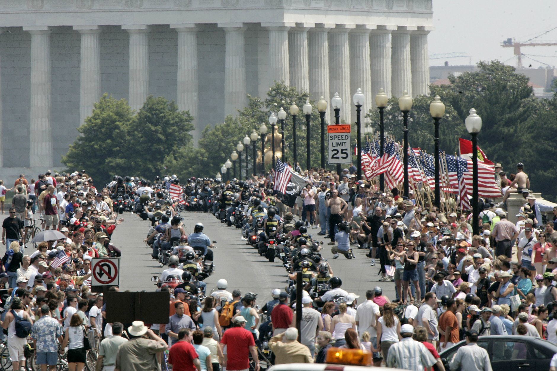 Tens of thousands of motorcycles roar across the Memorial Bridge with the Lincoln Monument in the background, as a part of the annual "Rolling Thunder" motorcycle ride, Sunday May 28, 2006, in Washington. The ride, which honors the nation's veterans, circles through downtown Washington and ends at the Vietnam Veterans Memorial. Bikers will hold their last Rolling Thunder ride in D.C. in 2019. (AP Photo/Lawrence Jackson)