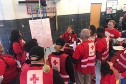 Volunteers are briefed before one recent "Sound the Alarm" activity. (Courtesy National Capitol Region American Red Cross/Paul Carden)