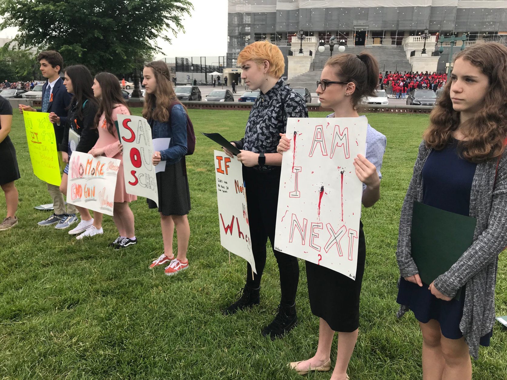 The group from Temple Emanuel, in Kensington, read the names of students who were killed last year at U.S. schools and held a moment of silence in front of the U.S. Capitol. (WTOP/Mitchell Miller)