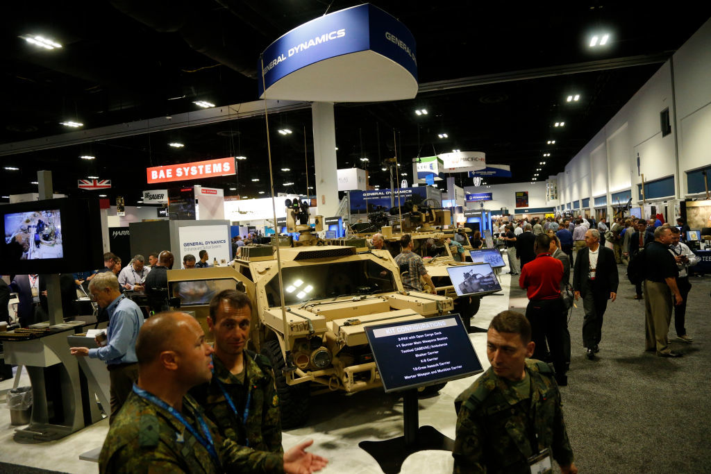 TAMPA, FL - MAY 23:  Attendees inspect the latest military technology and gear, including the Flyer 72 Lightweight Ground Mobility Vehicle by General Dynamics, during the Special Operations Forces Industry Conference (SOFIC) on May 23, 2018 in Tampa, Florida. SOFIC allows industry participants opportunities for networking, business intelligence, brand promotion and product demonstration as well as tips on how to do business with the U.S. Special Operations Command. (Photo by Brian Blanco/Getty Images)