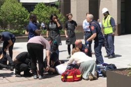 Medics and bystanders treating an injured kitchen worker in Ballston