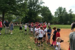 Players with the Capitol City Little League line up to meet Nationals star left-handed pitcher Patrick Corbin at Lafayette Recreation Center in NW D.C. (WTOP/Dick Uliano)