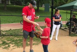 Nationals star left-handed pitcher Patrick Corbin hands out autographs and baseballs. (WTOP/Dick Uliano)