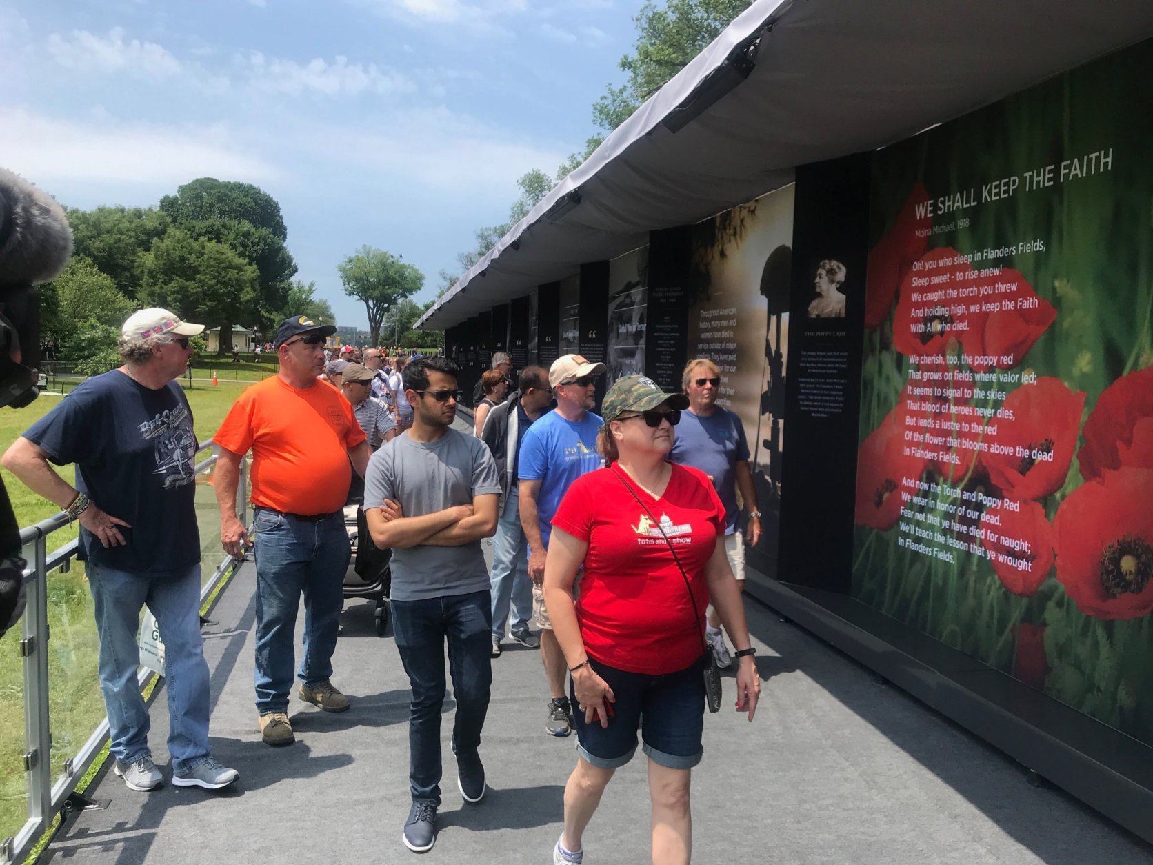 Visitors walk along the Poppy Wall of Honor. (WTOP/Dick Uliano)