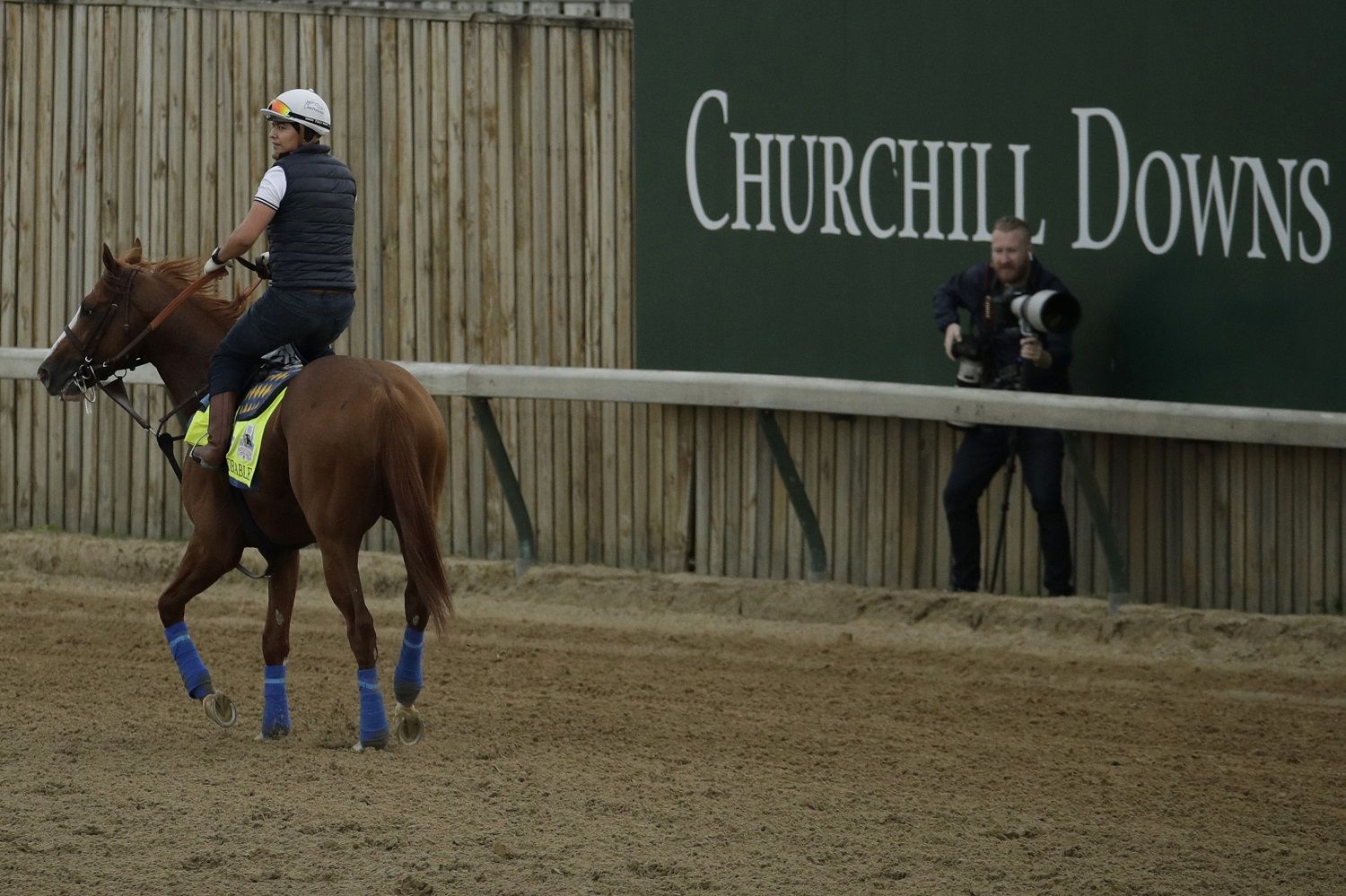 Kentucky Derby entrant Improbable is ridden during a workout at Churchill Downs Wednesday, May 1, 2019, in Louisville, Ky. The 145th running of the Kentucky Derby is scheduled for Saturday, May 4. (AP Photo/Charlie Riedel)