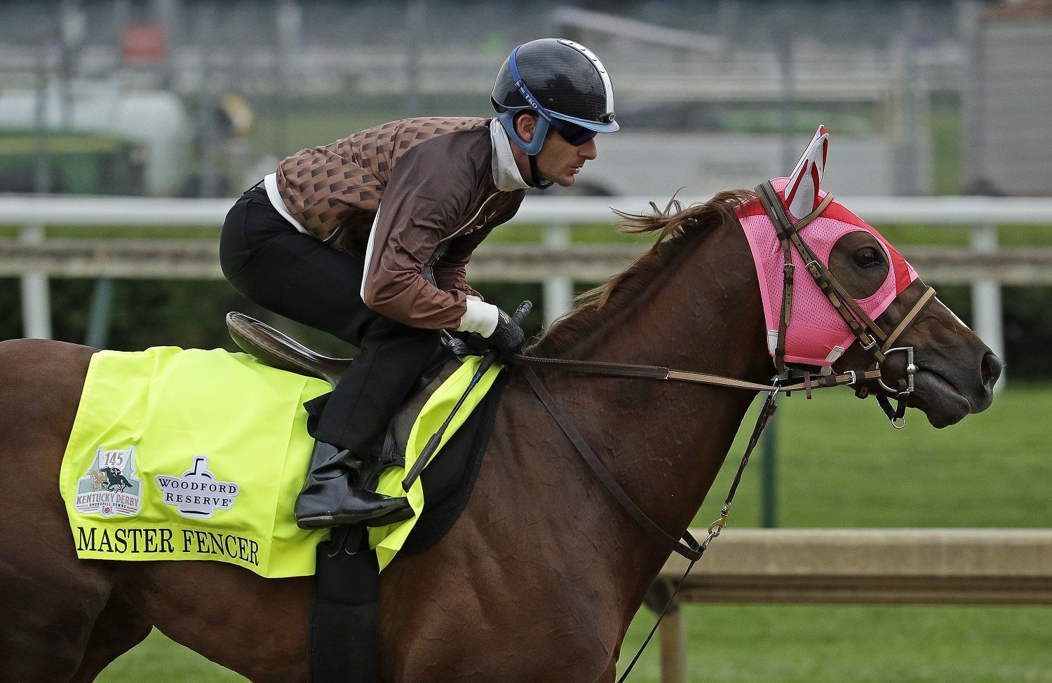 Kentucky Derby hopeful Master Fencer is ridden during a workout at Churchill Downs Tuesday, April 30, 2019, in Louisville, Ky. The 145th running of the Kentucky Derby is scheduled for Saturday, May 4. (AP Photo/Charlie Riedel)