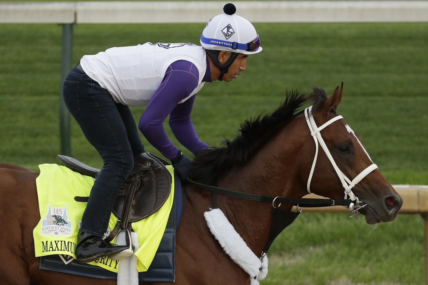 Kentucky Derby entrant Maximum Security is ridden during a workout at Churchill Downs Wednesday, May 1, 2019, in Louisville, Ky. The 145th running of the Kentucky Derby is scheduled for Saturday, May 4. (AP Photo/Charlie Riedel)