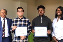 Vincent Zelaya and Dylan Brown, $1,000 Scholarship winners, are pictured with FACTS Chair Howard Burnett and Prince George's County School Board member Sonya Williams. (WTOP/Kristi King)