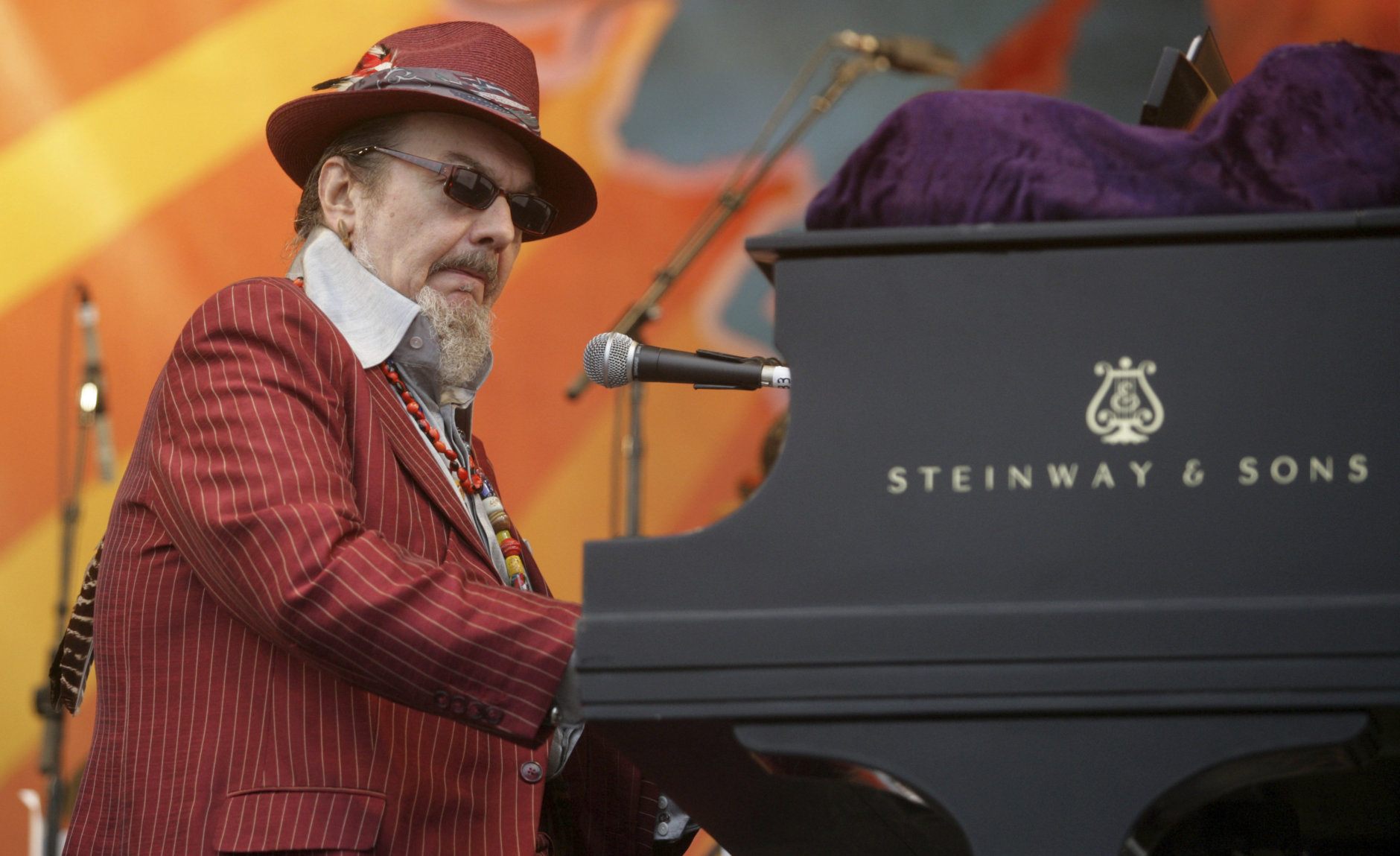 FILE - In this April 26, 2008 file photo, Dr. John performs during the 2008 New Orleans Jazz &amp; Heritage Festival in New Orleans. The family of the Louisiana-born musician known as Dr. John says the celebrated singer and piano player who blended black and white musical influence with a hoodoo-infused stage persona and gravelly bayou drawl, has died. He was 77. A family statement released by his publicist says Dr. John, who was born Mac Rebennack, died early Thursday of a heart attack. (AP Photo/Dave Martin, File)