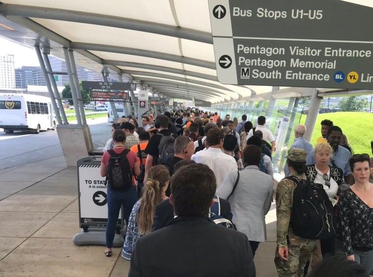 At the Pentagon, a long line of riders waited Tuesday afternoon to catch an express shuttle to the Huntington station. (Courtesy @NRLombardo via Twitter)