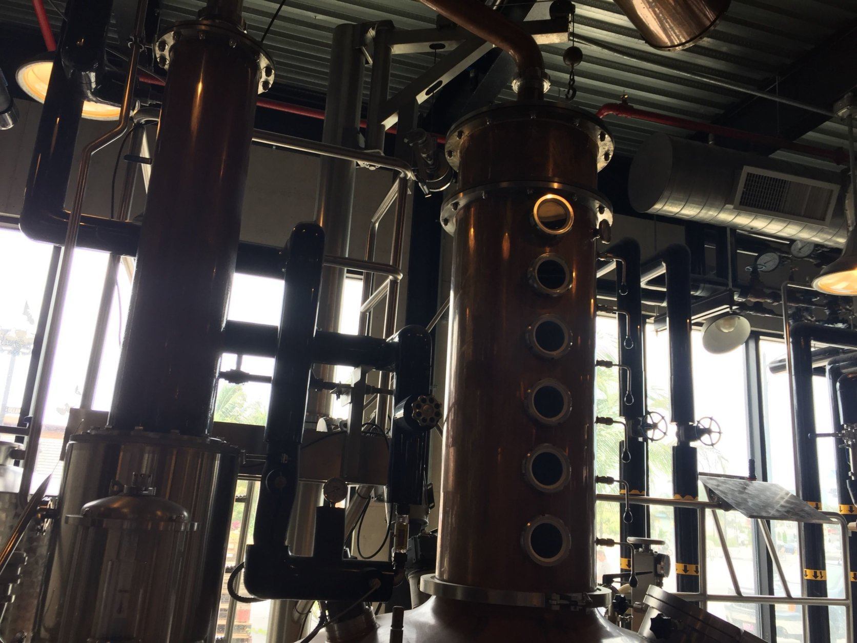 The distillery itself is a modern building with lots of modern distilling equipment, all wrapped in items dating back to 1933 or before. (WTOP/John Domen)